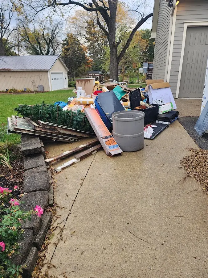 Dumpster being loaded with debris for Residential Dumpster Rental in Marion